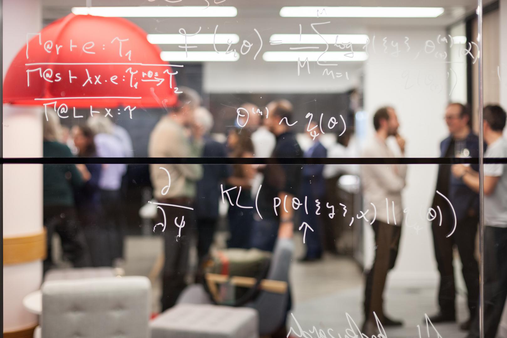 Researchers networking in The Alan Turing Institute headquarters.