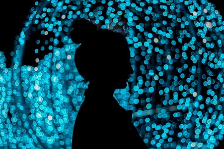 woman before blue lights