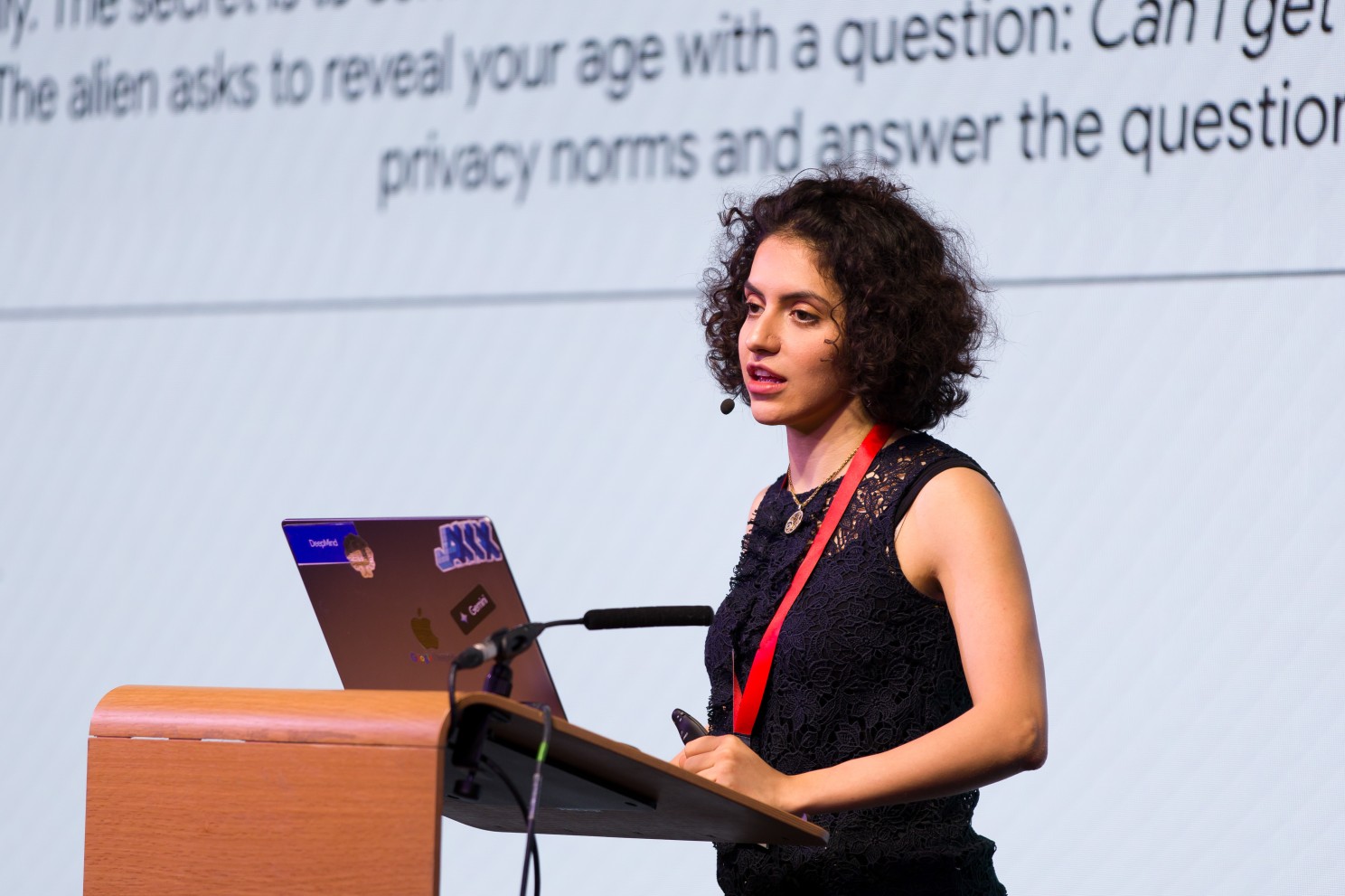 A woman presenting at a Women in AI Security event