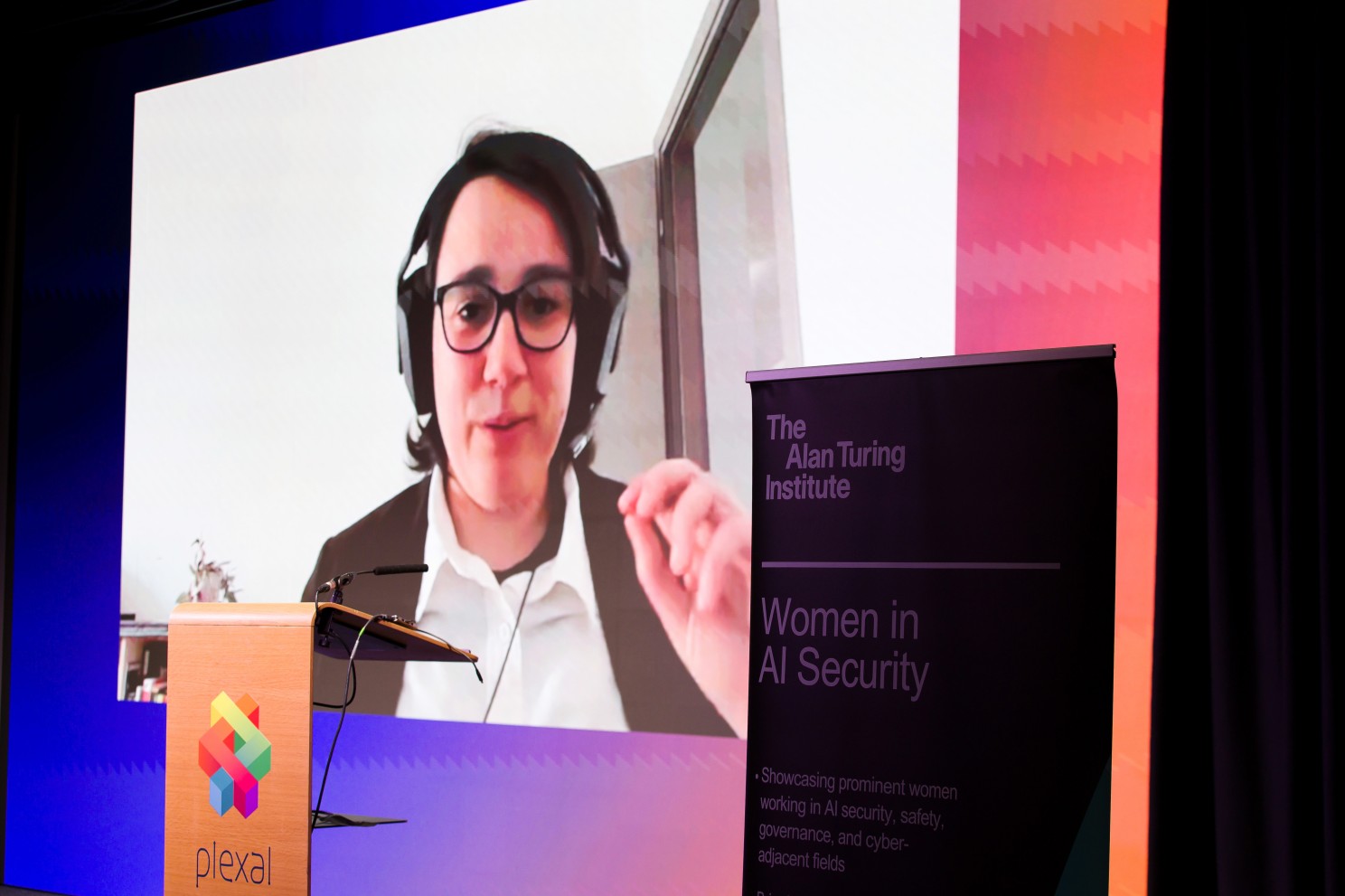 A woman presenting virtually at a Women in AI Security event