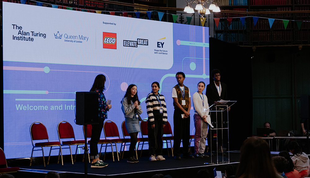 Children speaking on stage at the Children's AI Summit