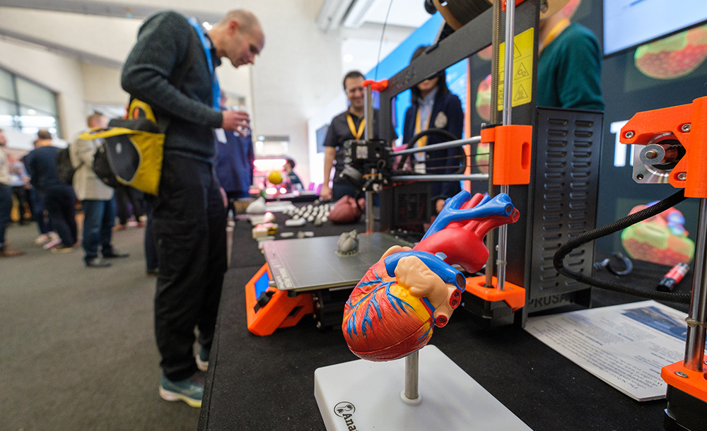 AI UK demo stand with plastic heart model in foreground