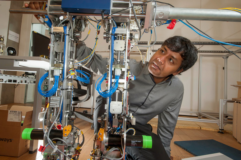 Professor Sethu Vijayakumar working on a robot